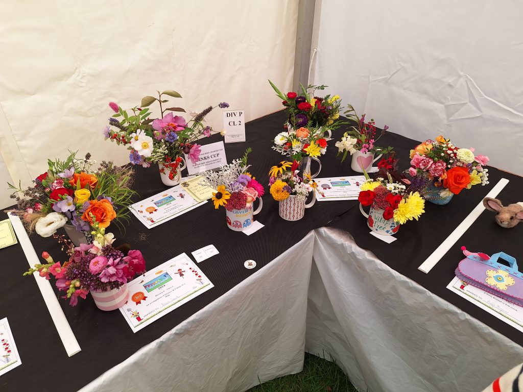 Children's "floral arrangement in a cup" entries